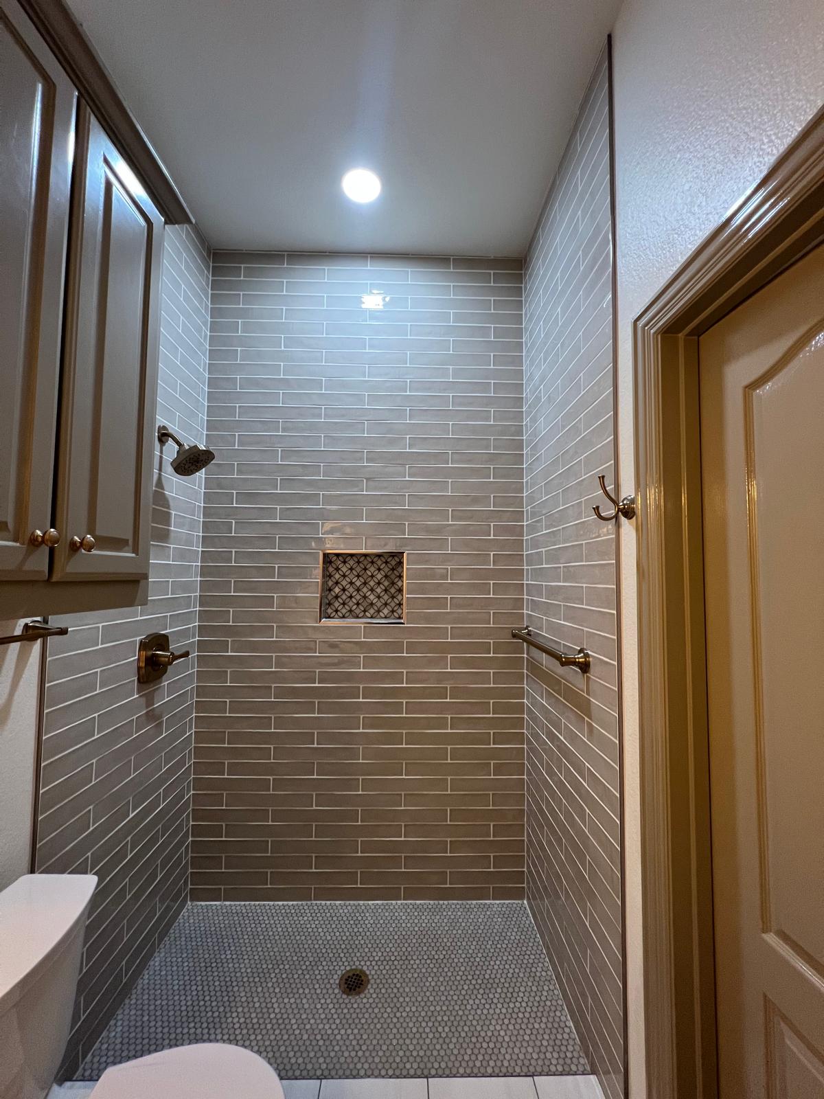 Completed tub-to-shower and walk-in shower project view 14